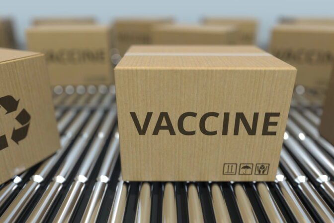 Boxes with a vaccine move on conveyors